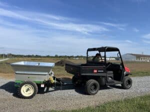Multispread 248PT being pulled by a UTV